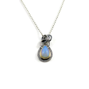 Stunning Welo opal teardrop necklace in 18K gold and sterling silver by Mikel Grant Jewellery