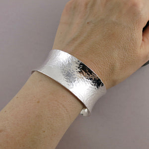 Wide hammer textured silver convex cuff bracelet by Mikel Grant Jewellery