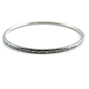 Bark textured silver bangle by Mikel Grant Jewellery. Artisan made textured & oxidized silver bangle.