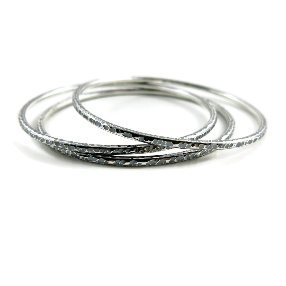 Bark textured silver bangle by Mikel Grant Jewellery. Artisan made textured & oxidized silver bangle.