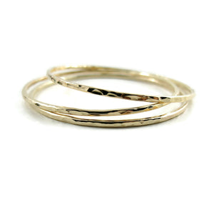 Hammered gold bangle by Mikel Grant Jewellery. Artisan made hammer textured 14K gold filled bangle bracelet.