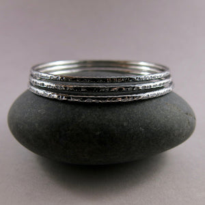 Bark textured silver bangle by Mikel Grant Jewellery. Artisan made textured & oxidized silver bangle.