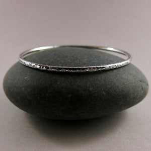 Bark textured silver bangle by Mikel Grant Jewellery. Artisan made textured & oxidized silver bangle.