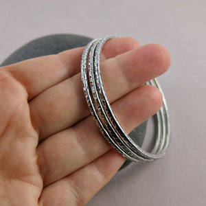 Bark textured silver bangle by Mikel Grant Jewellery. Artisan made textured & oxidized silver bangle.