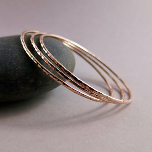 Rose gold bangle by Mikel Grant Jewellery.  Artisan made hammer textured 14K rose gold filled bangle.