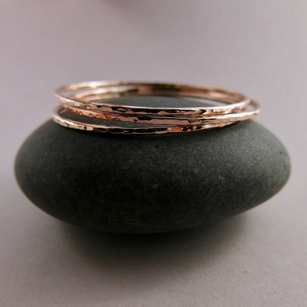 Rose gold bangle by Mikel Grant Jewellery. Artisan made hammer textured 14K rose gold filled bangle.