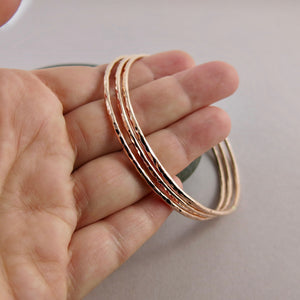 Rose gold bangle by Mikel Grant Jewellery. Artisan made hammer textured 14K rose gold filled bangle.