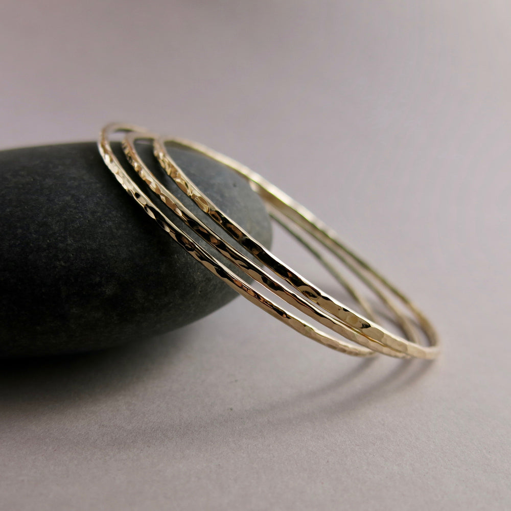Hammered gold bangle by Mikel Grant Jewellery.  Artisan made hammer textured 14K gold filled bangle bracelet.