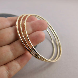 Hammered gold bangle by Mikel Grant Jewellery. Artisan made hammer textured 14K gold filled bangle bracelet.