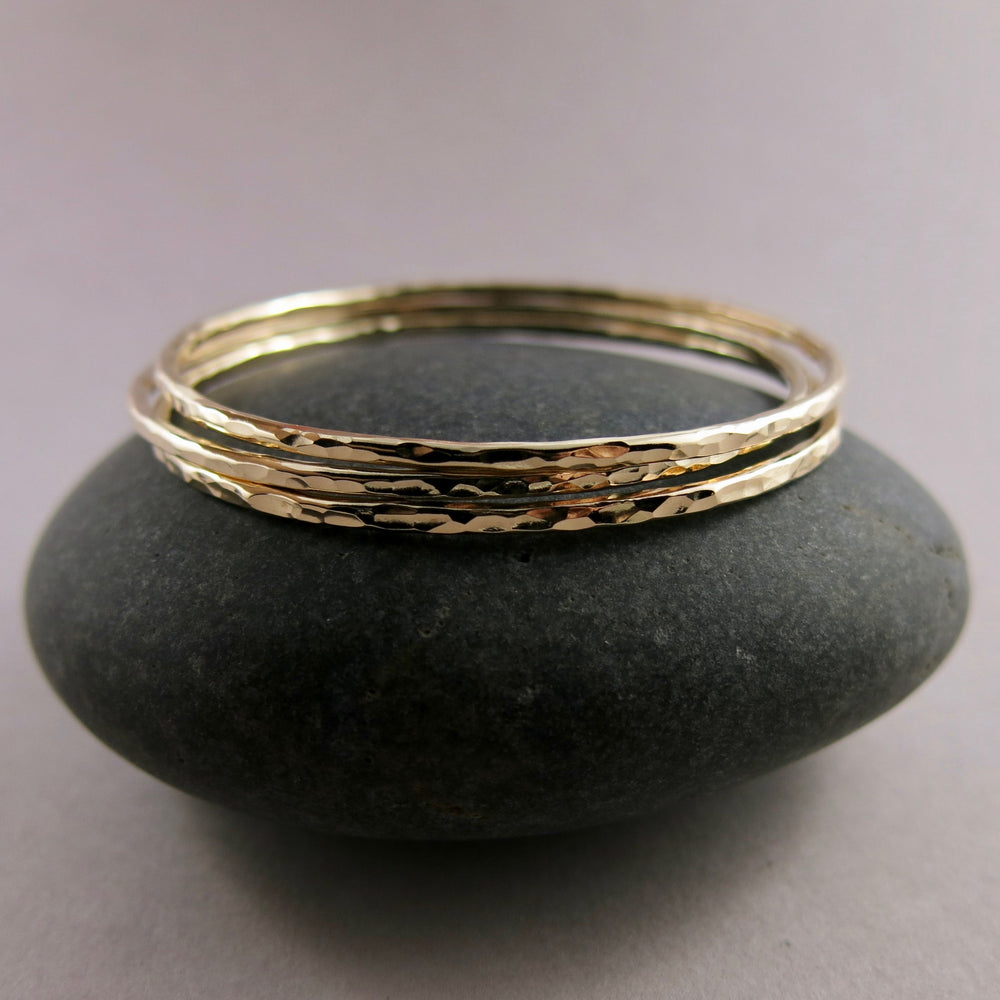 Hammered gold bangle by Mikel Grant Jewellery. Artisan made hammer textured 14K gold filled bangle bracelet.