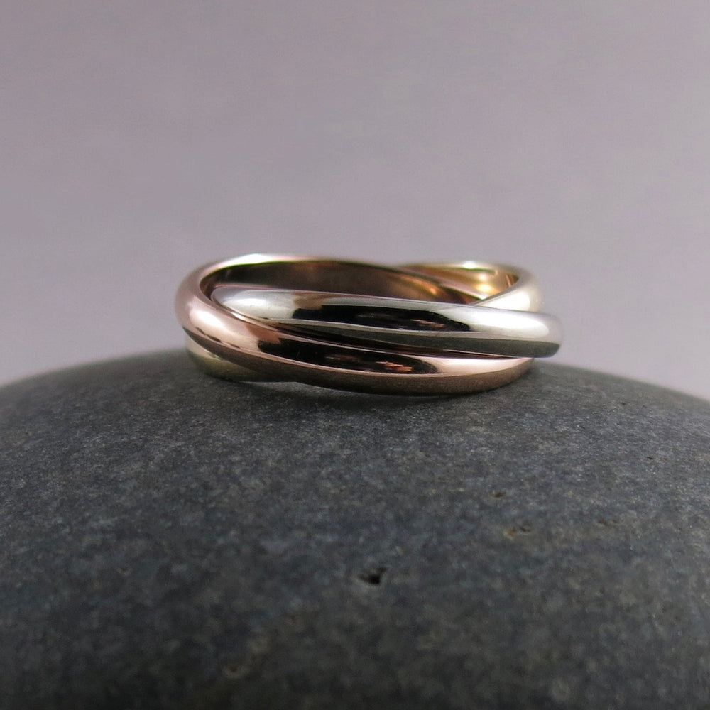 Mixed gold trinity rolling ring by Mikel Grant Jewellery.  14K yellow, rose & white gold Russian wedding ring.  