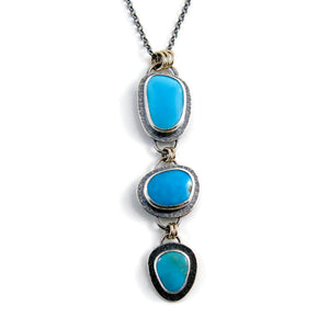 Artisan made Cascade Necklace. Kingman turquoise in oxidized textured sterling silver with 14K gold accents by Mikel Grant Jewellery.