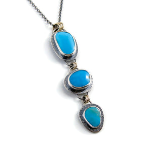 Artisan made Cascade Necklace. Kingman turquoise in oxidized textured sterling silver with 14K gold accents by Mikel Grant Jewellery.
