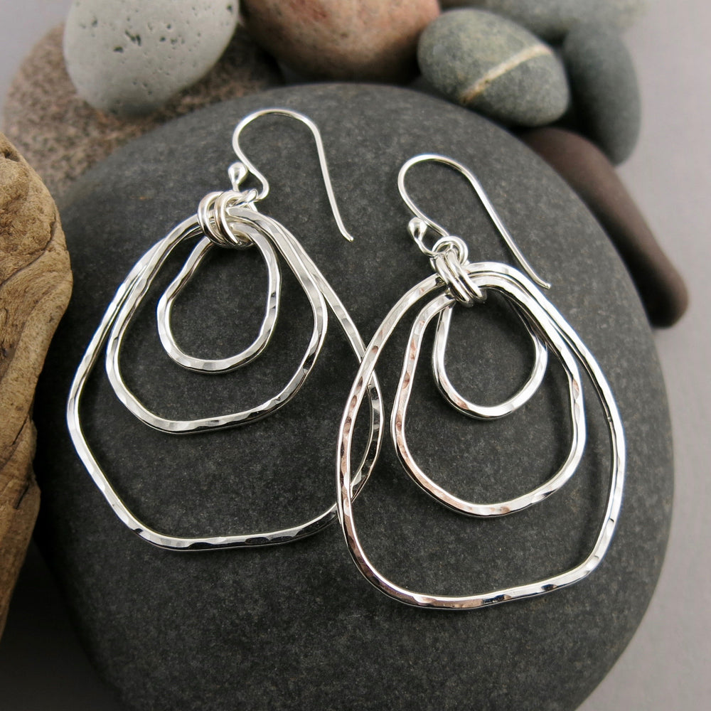 Coast Trio Earrings: free form nesting silver dangles with rustic hammer texture by Mikel Grant Jewellery