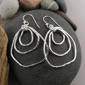 Coast Trio Earrings: free form nesting silver dangles with rustic hammer texture by Mikel Grant Jewellery