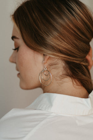 Coast Trio Earrings: free form nesting silver dangles with rustic hammer texture by Mikel Grant Jewellery