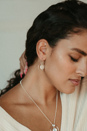 White coin pearl earrings in sterling silver by Mikel Grant Jewellery.