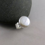 White coin pearl ring in sterling silver by Mikel Grant Jewellery.