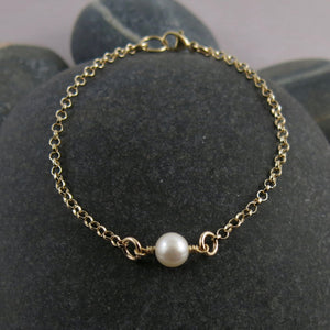 Delicate luxe single pearl bracelet in 14K gold by Mikel Grant Jewellery