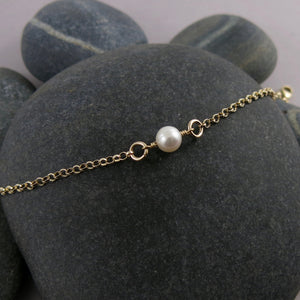 Delicate luxe single pearl bracelet in 14K gold by Mikel Grant Jewellery