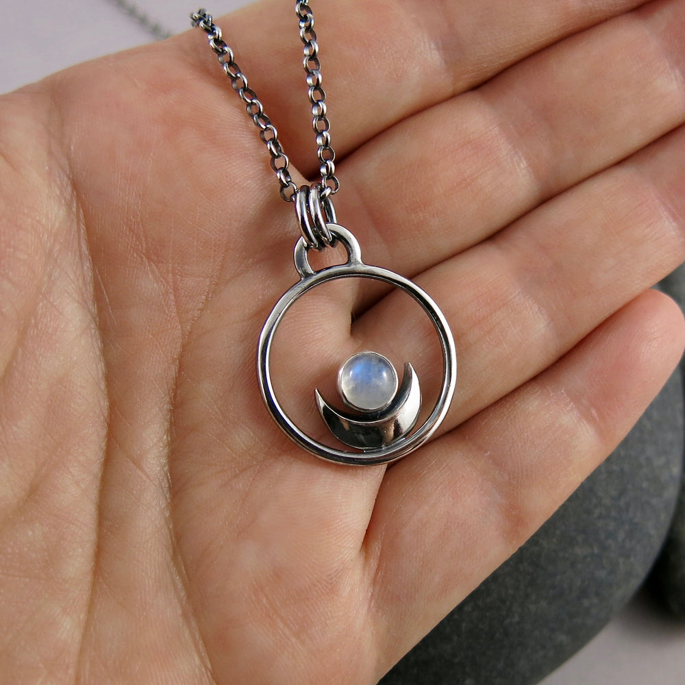 Dream Necklace by Mikel Grant Jewellery. Silver Crescent Moon Cradling a Rainbow Moonstone.