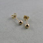 Solid gold ball studs by Mikel Grant Jewellery.