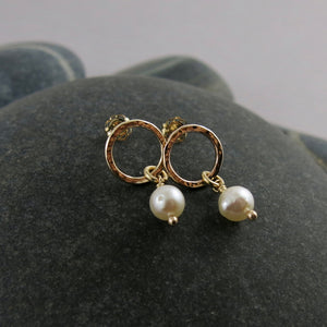 Gold open circle studs with white baroque pearl drops by Mikel Grant Jewellery.