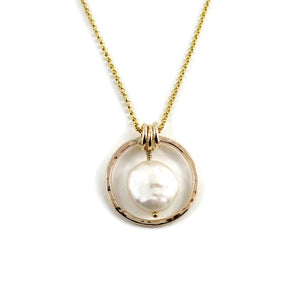 Gold coin pearl necklace by Mikel Grant Jewellery. Lustrous white freshwater coin pearl suspended within a hammer textured gold filled circle.