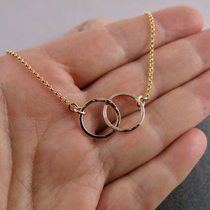 Interlocking gold rings necklace by Mikel Grant Jewellery. 14K gold filled embrace necklace.