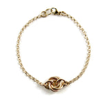 Gold eternity love knot bracelet by Mikel Grant Jewellery.  Solid 14K gold moveable infinite knot bracelet.