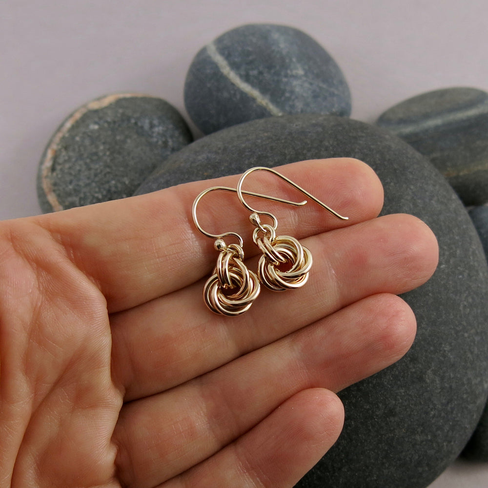 Gold eternity love knot earrings by Mikel Grant Jewellery. Solid 14K gold moveable infinite knot earrings.