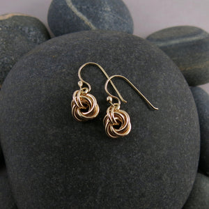 Gold eternity love knot earrings by Mikel Grant Jewellery. Solid 14K gold moveable infinite knot earrings.