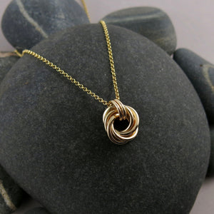 Gold eternity love knot necklace by Mikel Grant Jewellery. Solid 14K gold moveable infinite knot necklace.