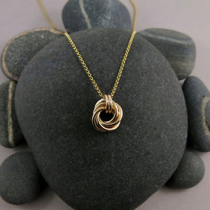 Gold eternity love knot necklace by Mikel Grant Jewellery. Solid 14K gold moveable infinite knot necklace.