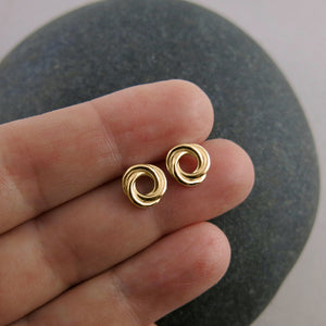 Gold love knot trio studs by Mikel Grant Jewellery.