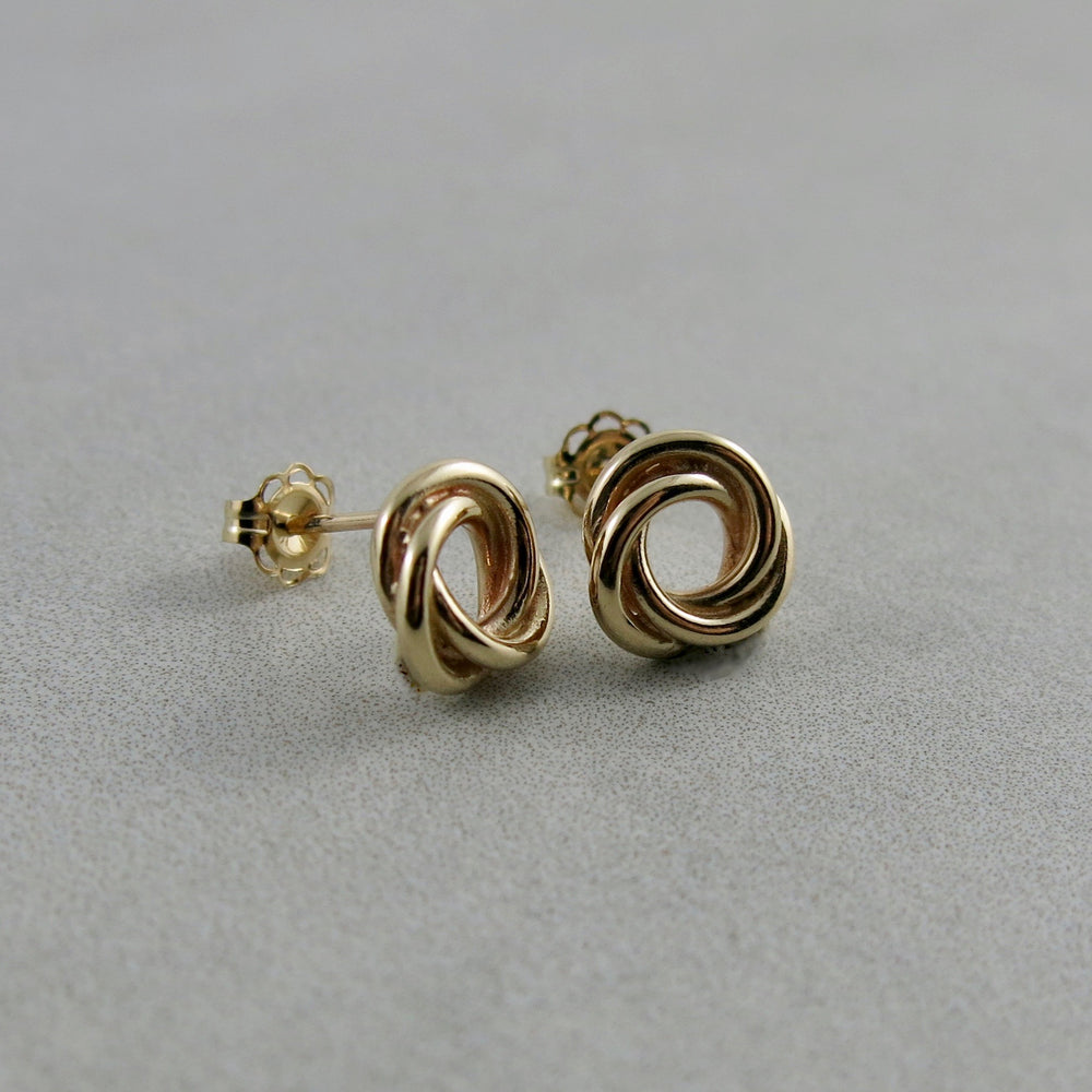 Gold love knot trio studs by Mikel Grant Jewellery.