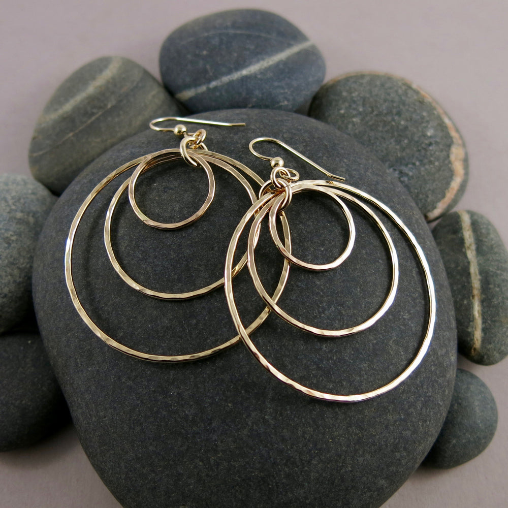 Hammered gold nesting trio circle earrings by Mikel Grant Jewellery. Artisan made bold dangle earrings.