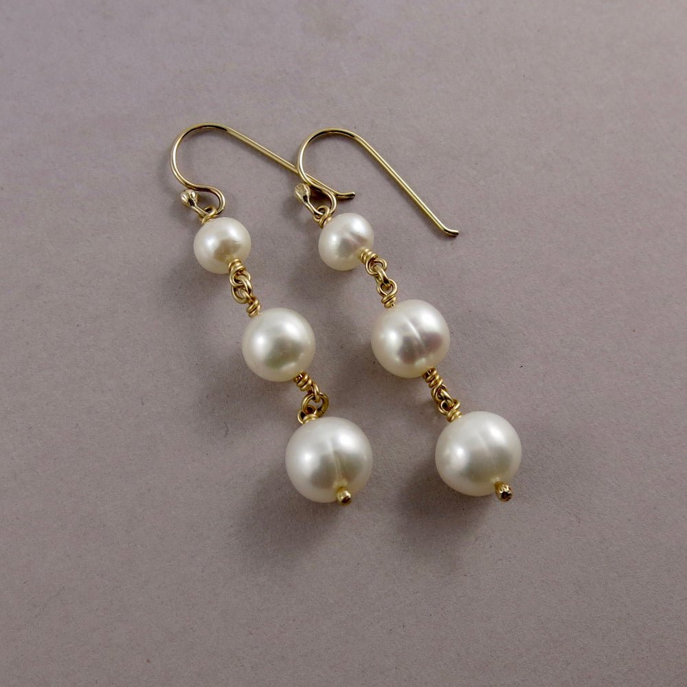 Pearl trio drop earrings in 14K gold by Mikel Grant Jewellery. Wedding jewellery.