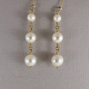 Pearl trio drop earrings in 14K gold by Mikel Grant Jewellery.  Wedding jewellery.