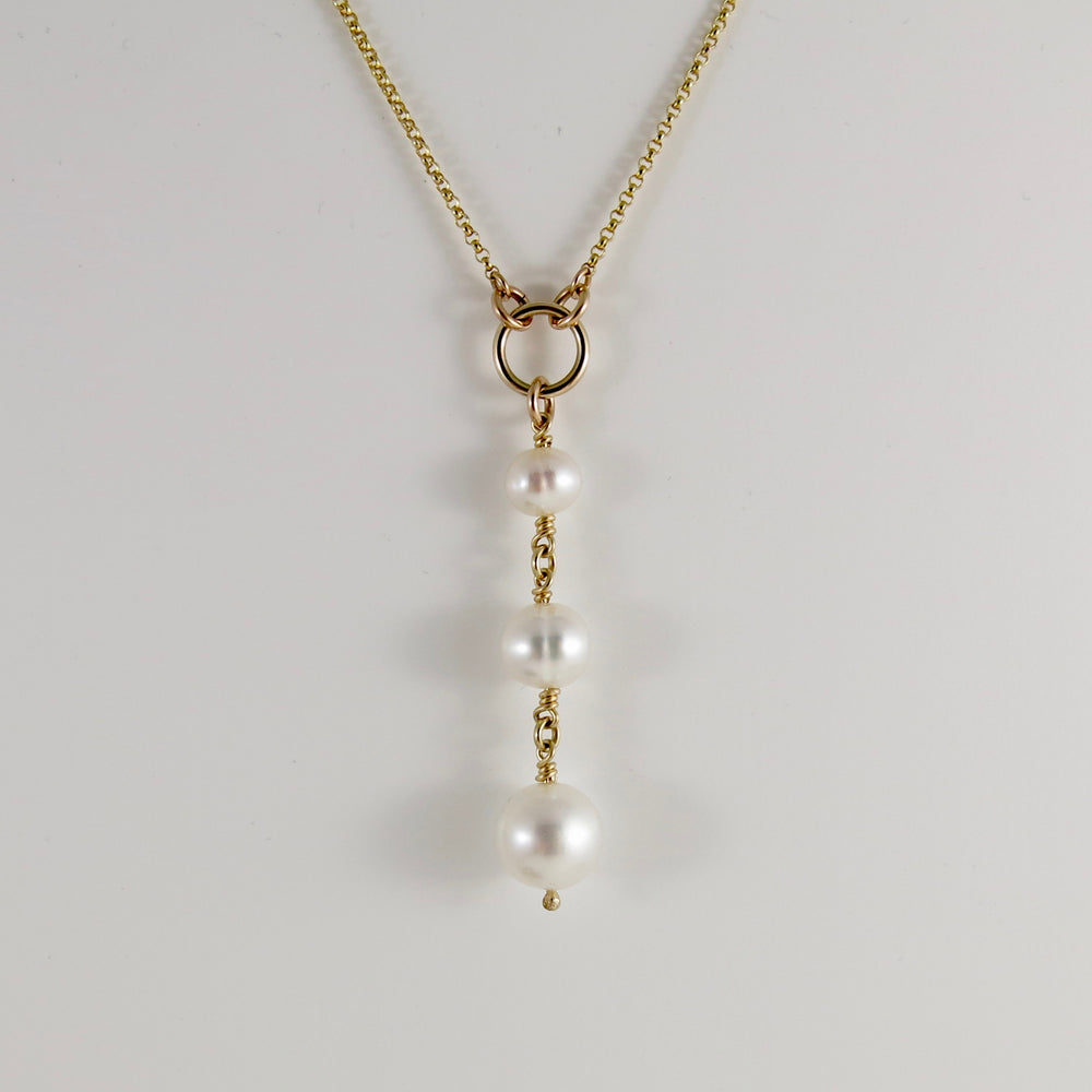 Pearl trio drop necklace in 14K gold by Mikel Grant Jewellery. Luxe wedding jewellery with white freshwater pearls.
