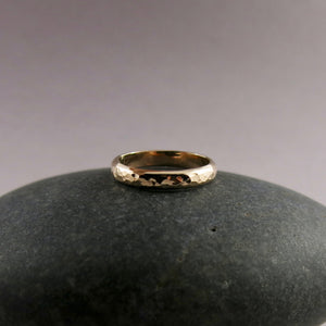 Gold steadfast ring by Mikel Grant Jewellery. 14K solid gold half round hammer textured band in medium width.