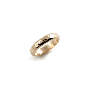 Gold steadfast ring by Mikel Grant Jewellery. Wide 14K solid gold half round hammer textured band.