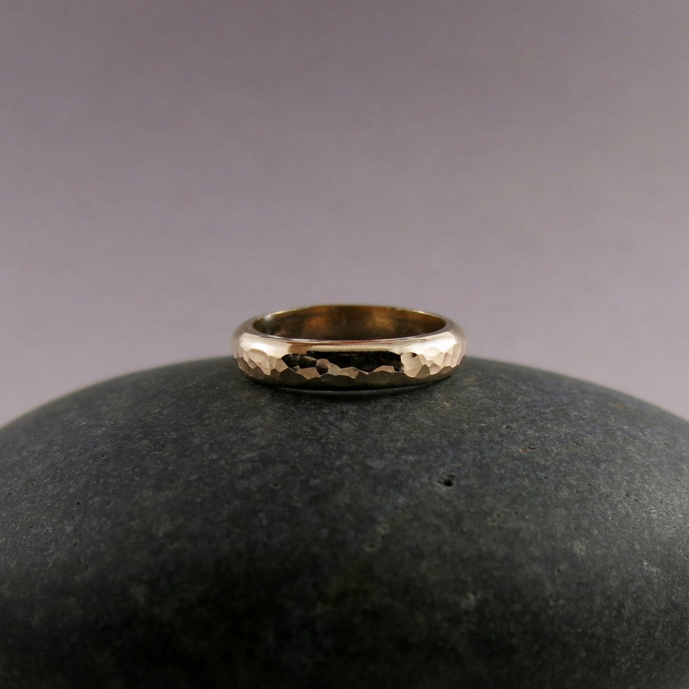 Gold steadfast ring by Mikel Grant Jewellery. Wide 14K solid gold half round hammer textured band.