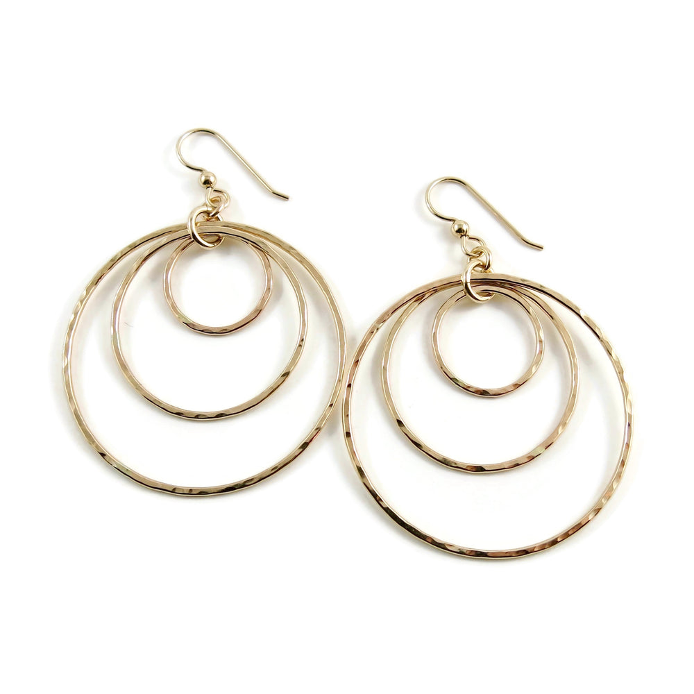 Hammered gold nesting trio circle earrings by Mikel Grant Jewellery. Artisan made bold dangle earrings.
