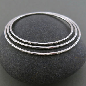 Silver hammer textured bangle by Mikel Grant Jewellery. Artisan made sterling silver bangle.