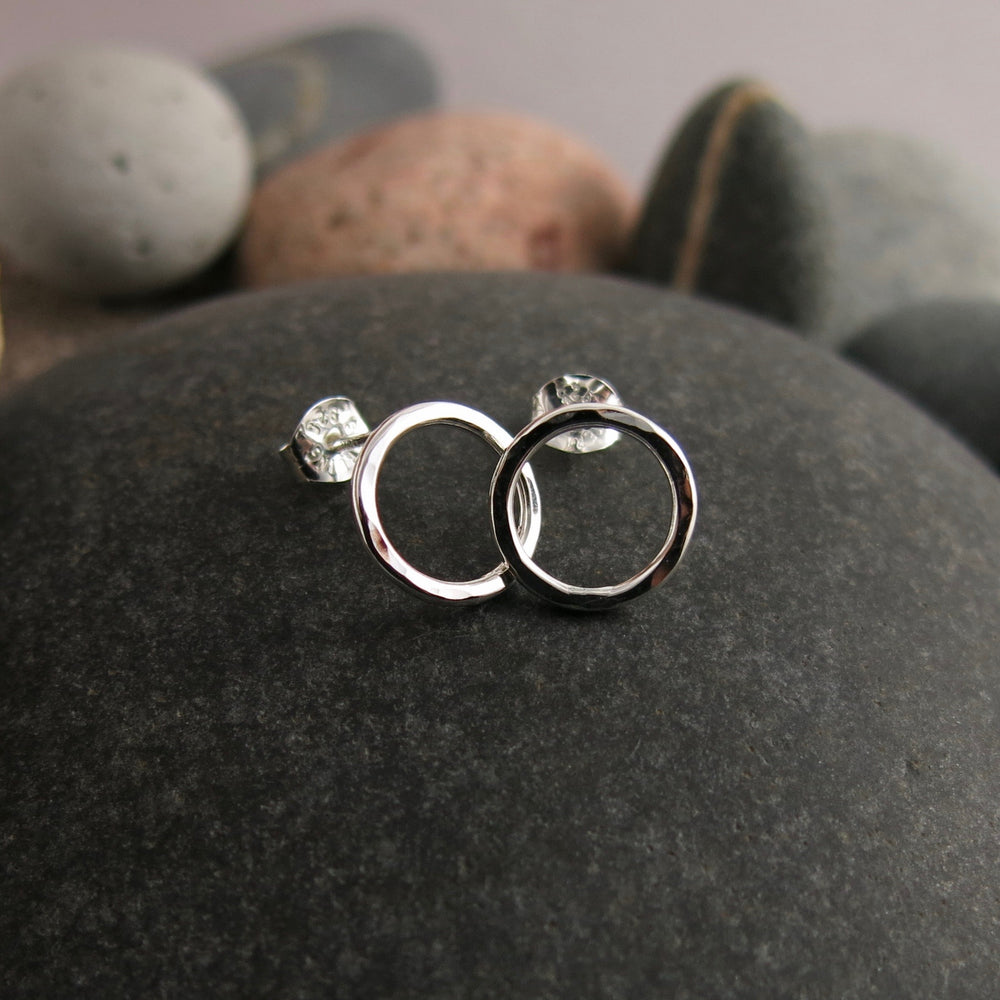 Silver open circle studs by Mikel Grant Jewellery.  Hammer textured silver circle studs.