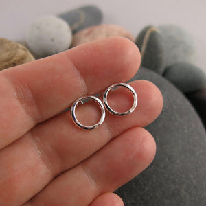 Silver open circle studs by Mikel Grant Jewellery. Hammer textured silver circle studs.