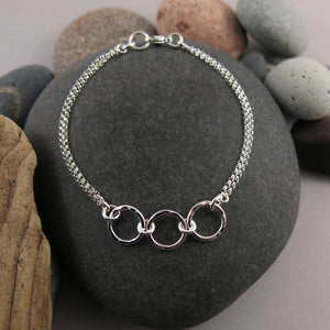 Silver open circle trio bracelet by Mikel Grant Jewellery. Hammer textured breathe trio bracelet.