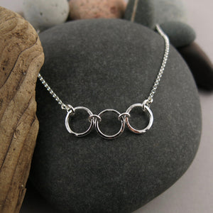 Silver open circles trio necklace by Mikel Grant Jewellery.  Hammer textured breathe trio necklace.