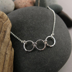 Silver open circles trio necklace by Mikel Grant Jewellery. Hammer textured breathe trio necklace.